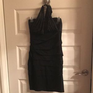 Sexy lil black dress with tieup around neck.  Pleated on bottom.